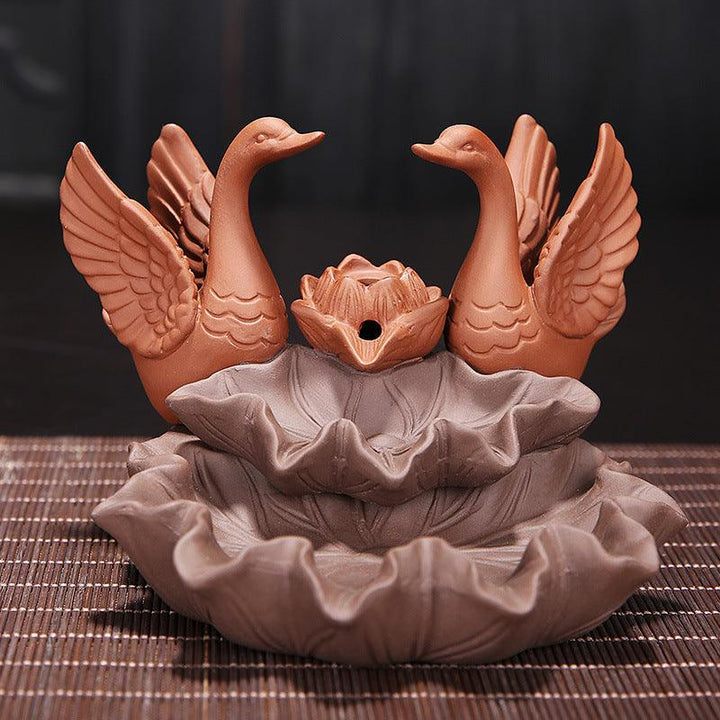 details of a couple of swan zen garden backflow incense burner holder