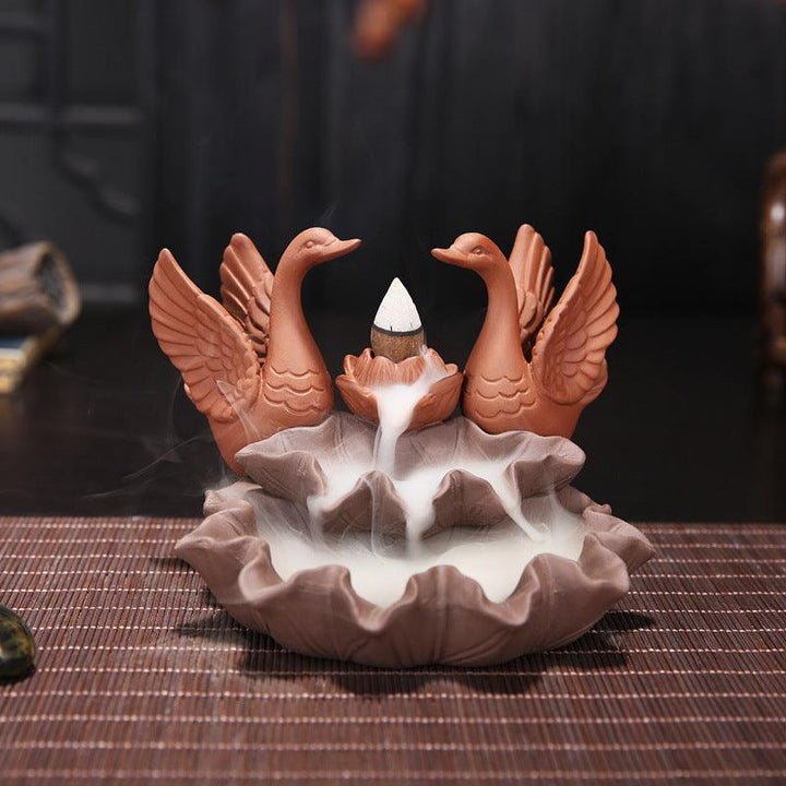 details of a couple of swan zen garden backflow incense burner holder