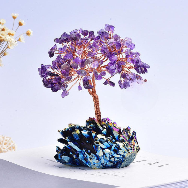 amethyst and rainbow crystal cluster bonsai tree on the table