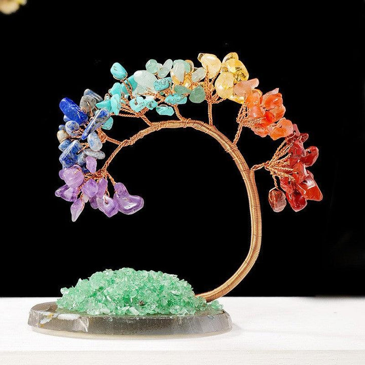 arc shaped multi colored crystal bonsai tree on the table