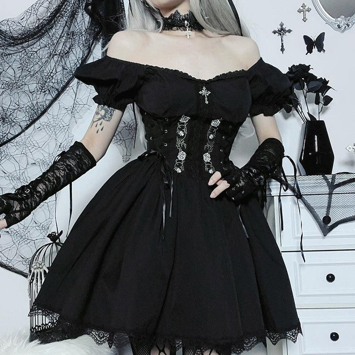 a woman wear a black gothic cross chain short lace dress