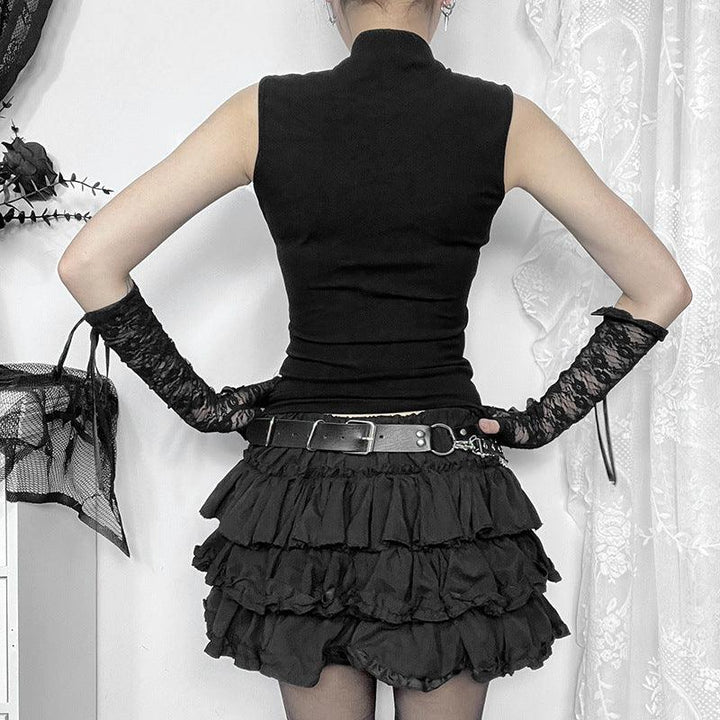 a woman wear a black gothic cross sleeveless top