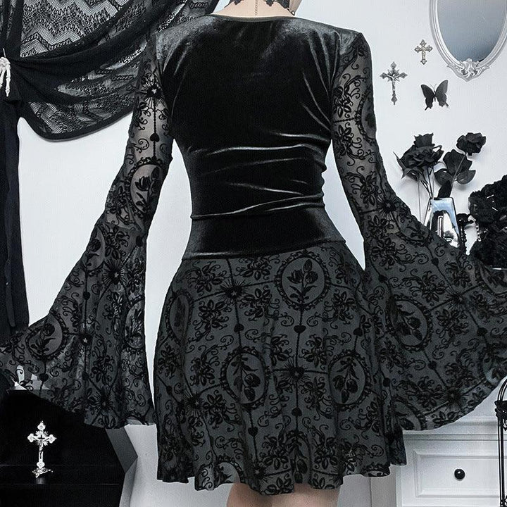 a woman wear a black gothic lace bell sleeve dress
