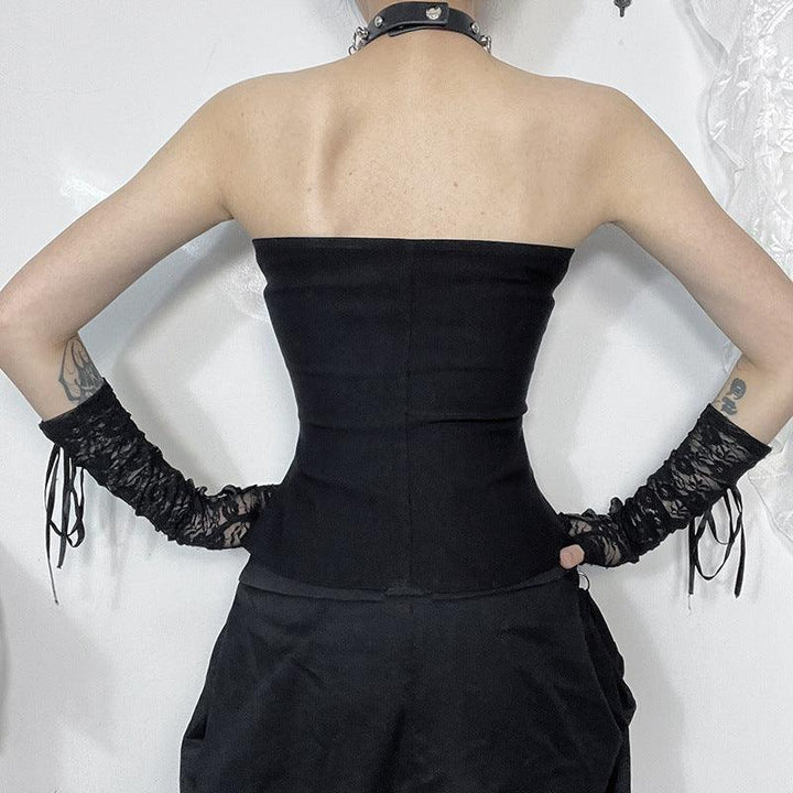 a woman wear a black gothic strapless leather buckle tank top