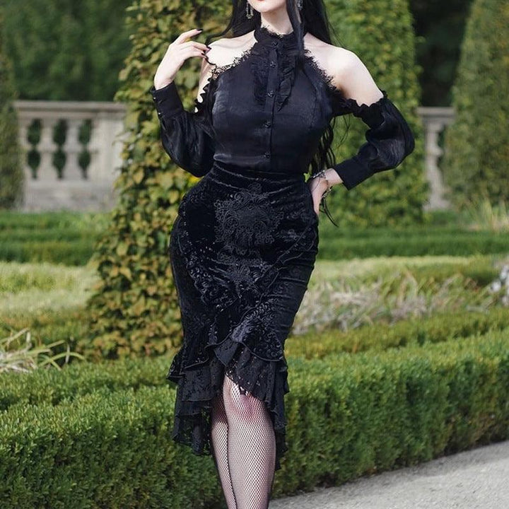 a woman wear a black gothic vampire half body long dress