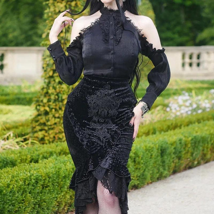 a woman wear a black gothic vampire half body long dress