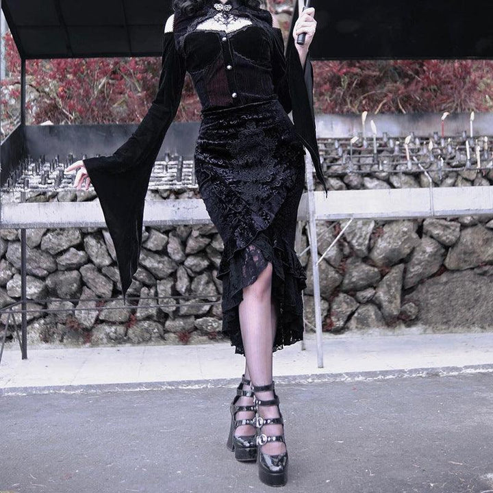 a woman wear a black gothic vampire half body long dress