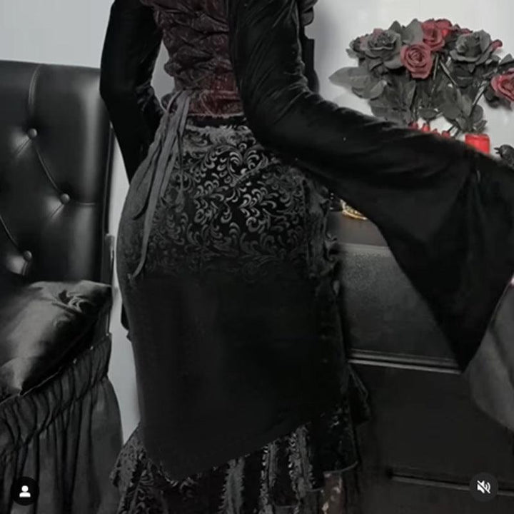 a woman wear a black gothic vampire half body long dress