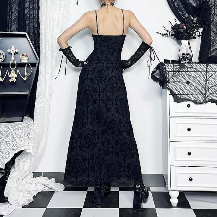 a woman wear a black gothic velvet spaghetti strap dress