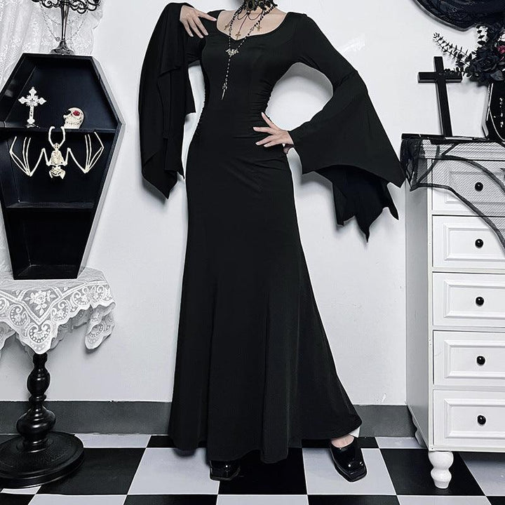 a woman wear a black long sleeve gothic formal dress