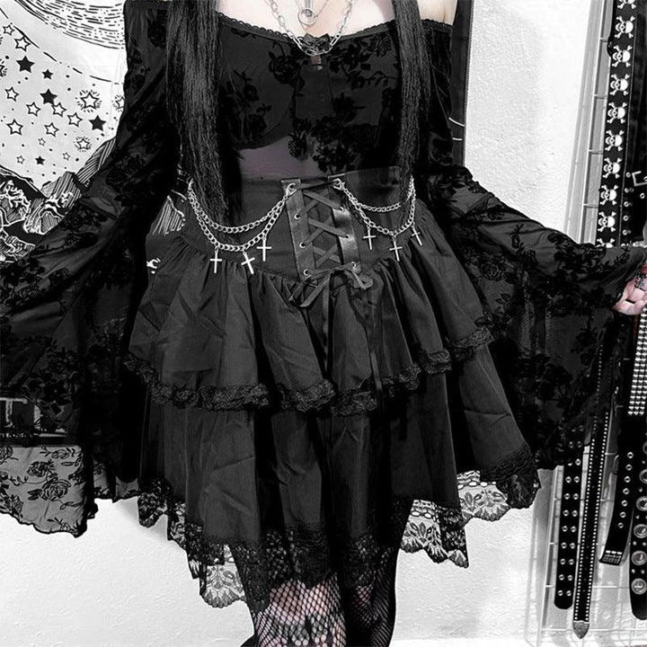 a woman wear a black punk short gothic dress