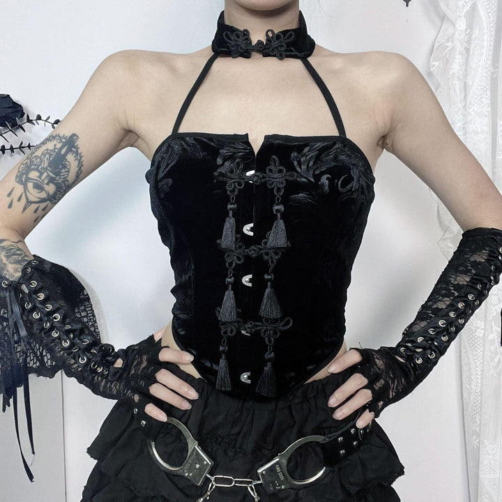 a woman wear a black sexy goth outfit necklace sleeveless tank
