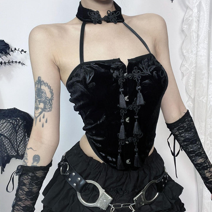 a woman wear a black sexy goth outfit necklace sleeveless tank