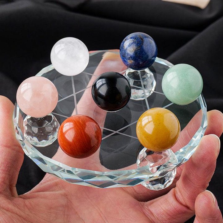 crystal ball seven star array ornament rainbow crystal raw stone on the table