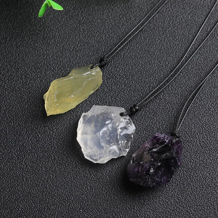 crystal healing gems irregular stone pendant necklace on the table