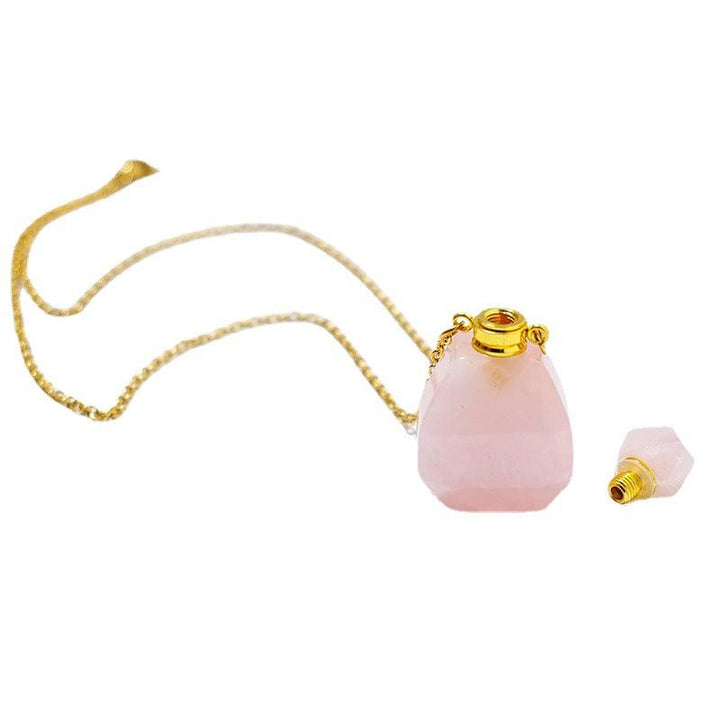 details of crystal perfume bottle raw stone necklace pendant