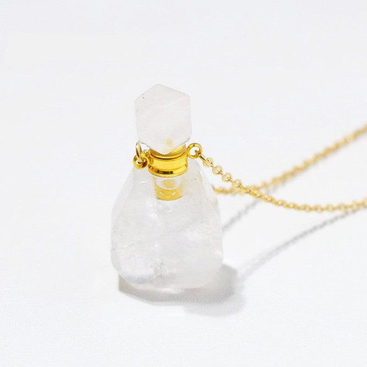 details of crystal perfume bottle raw stone necklace pendant