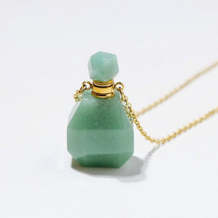 details of crystal perfume bottle raw stone necklace pendant