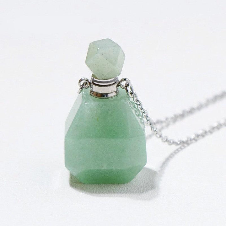 details of crystal perfume bottle raw stone necklace pendant