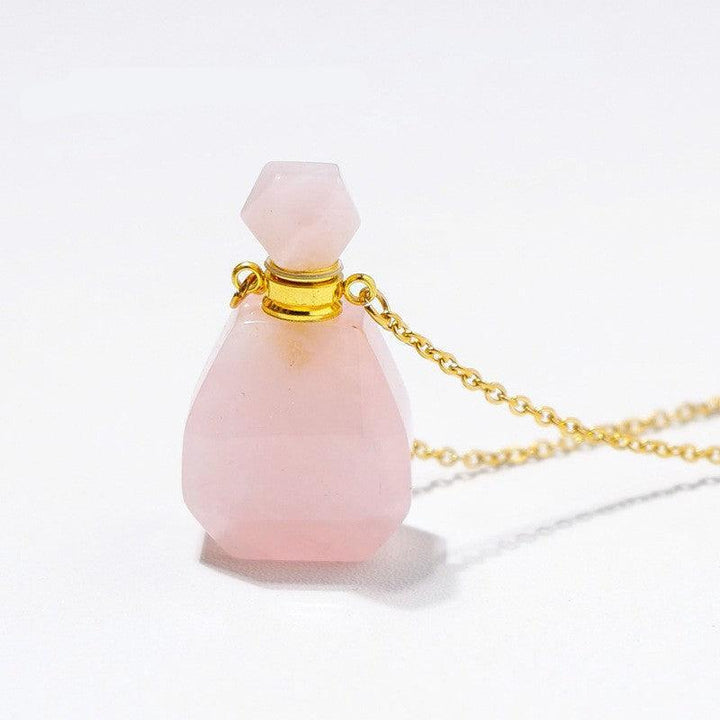 details of crystal perfume bottle raw stone necklace pendant