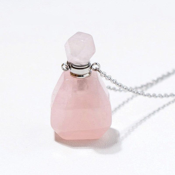 details of crystal perfume bottle raw stone necklace pendant