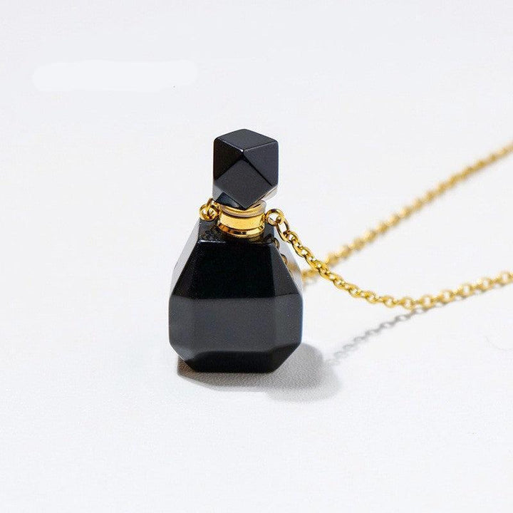 details of crystal perfume bottle raw stone necklace pendant