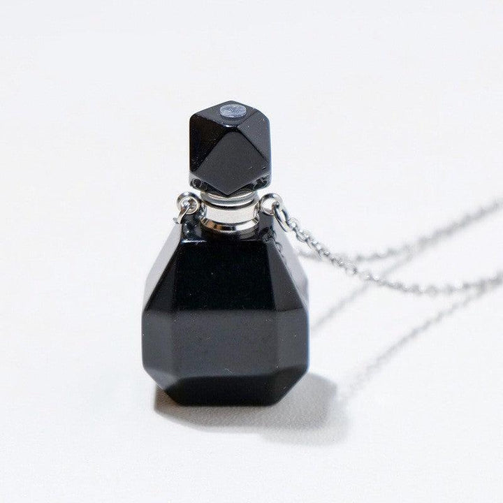 details of crystal perfume bottle raw stone necklace pendant