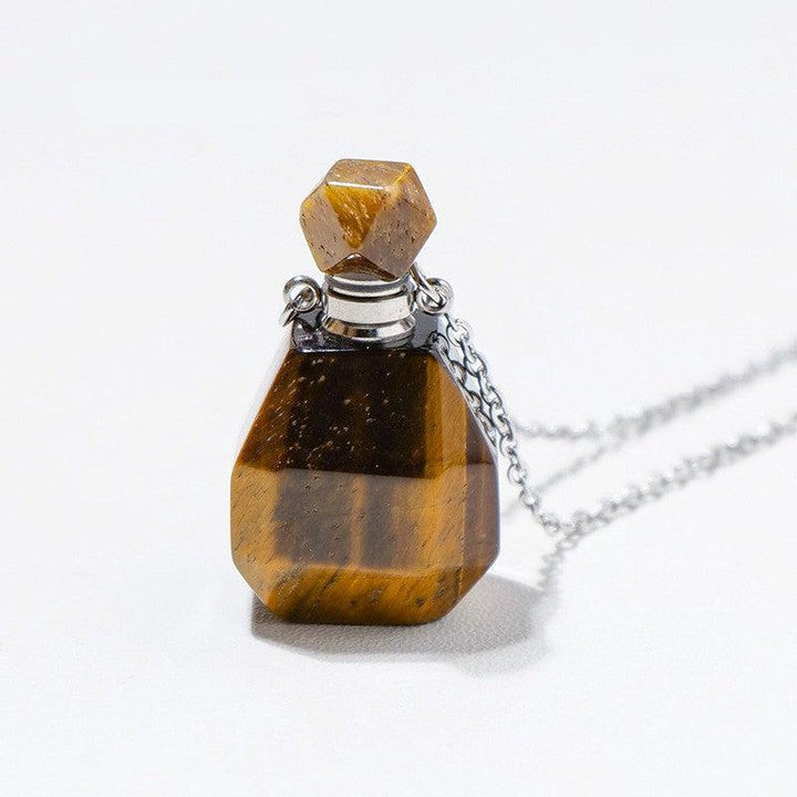 details of crystal perfume bottle raw stone necklace pendant