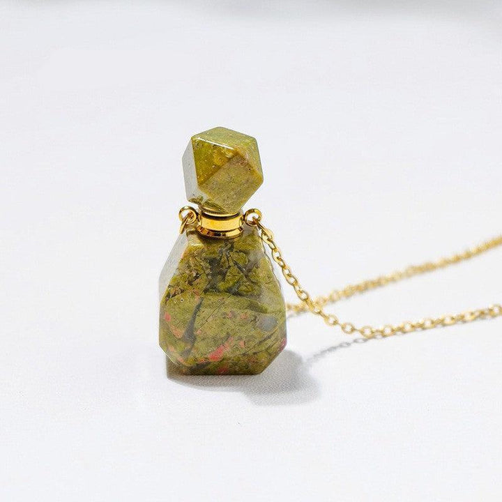 details of crystal perfume bottle raw stone necklace pendant