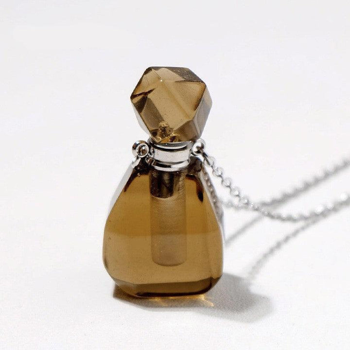 details of crystal perfume bottle raw stone necklace pendant