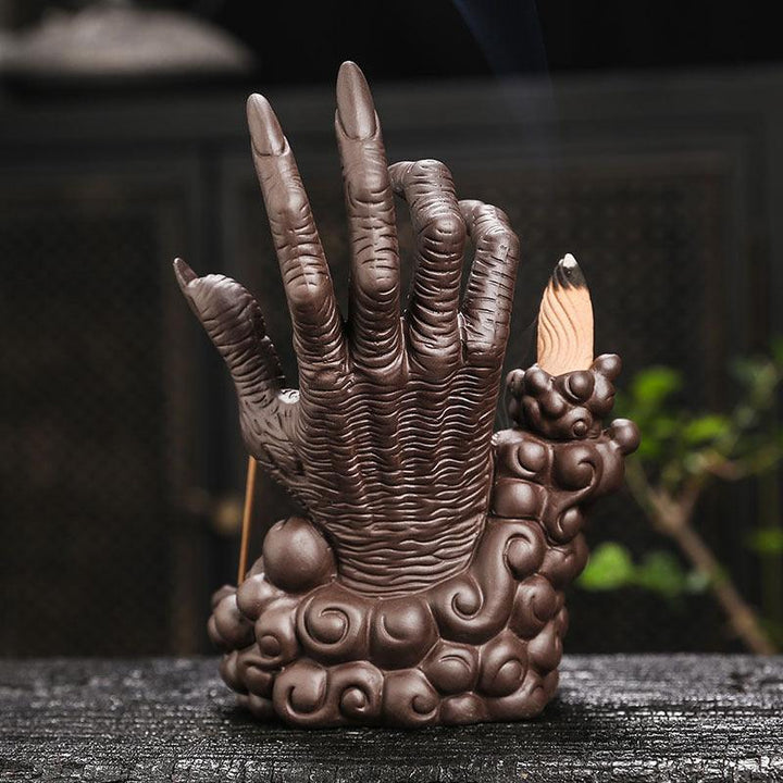 devils hand and eye with led light backflow incense burner holder on the table