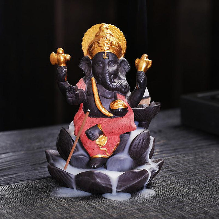 ganesh statue on lotus zen alabaster incense burner holder on the table