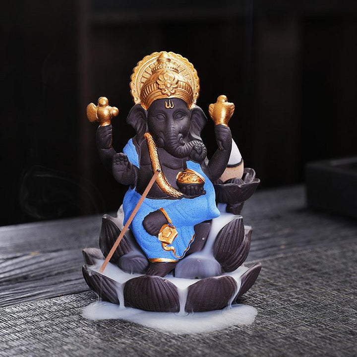 details of ganesh statue on lotus zen alabaster incense burner holder