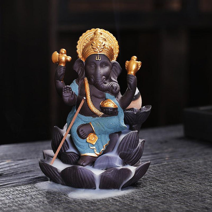 details of ganesh statue on lotus zen alabaster incense burner holder