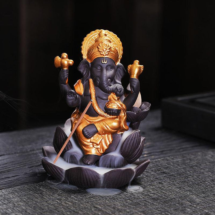 details of ganesh statue on lotus zen alabaster incense burner holder