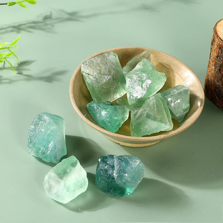 green fluorite crystal raw stone healing gemstones on the table