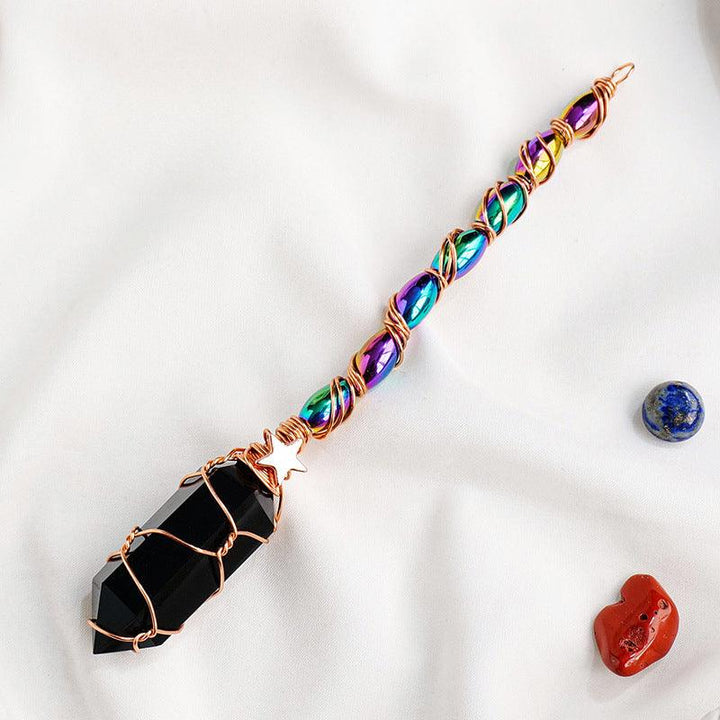 hexagonal obsidian crystal magic energy wand with gold wire wrapping