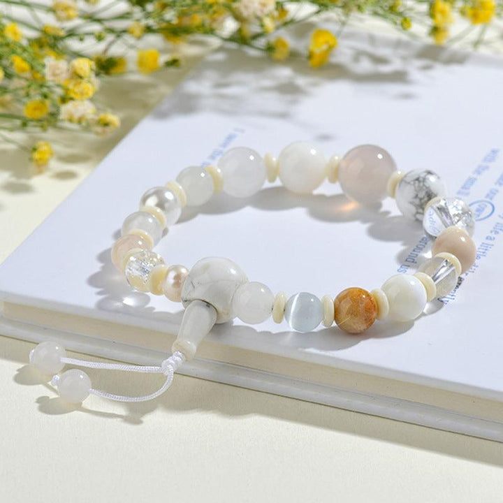 metal element bracelet five elements crystal feng shui bracelet on the table