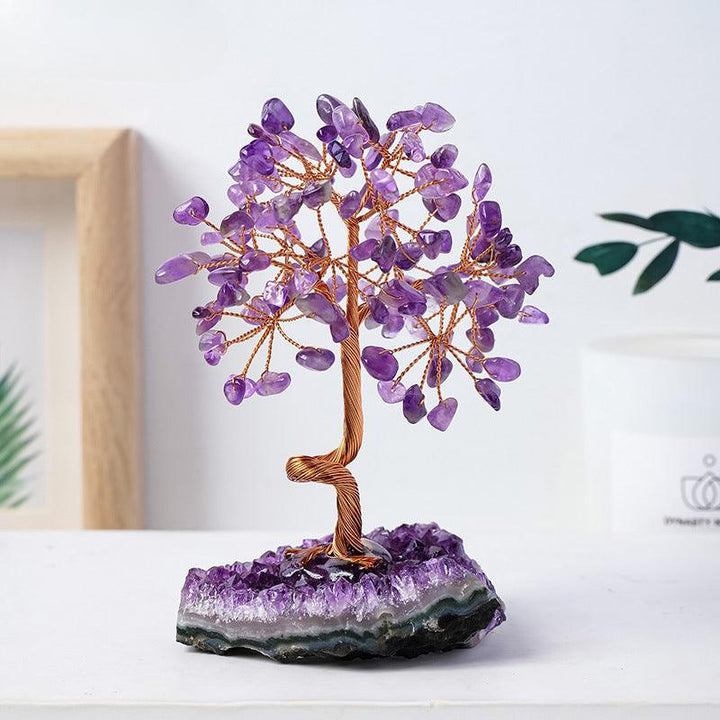 natural amethyst cluster crystal bonsai tree on the table