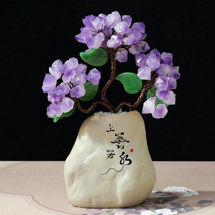 natural crystal bonsai tree with ceramic base on the table