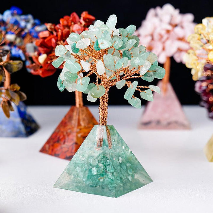 details of natural crystal bonsai tree with resin pyramid base