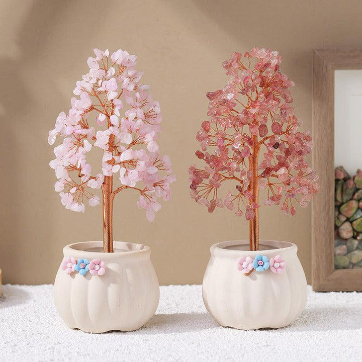 two natural crystal bonsai tree with white flower pot base on the table