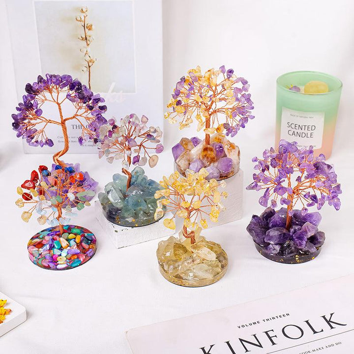 natural crystal gemstone tree with resin base on the table