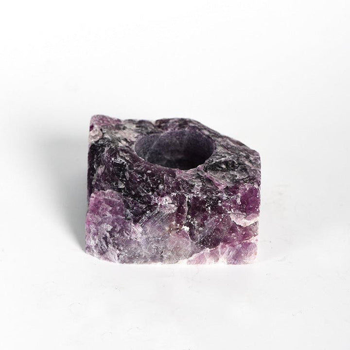 natural amethyst crystal raw stone candle holder on the table