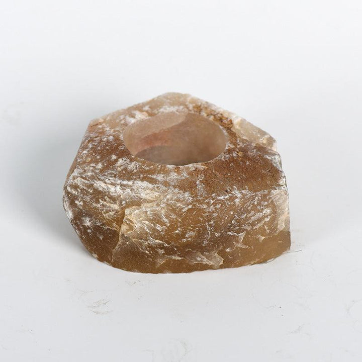 natural yellow fluorite crystal raw stone candle holder on the table