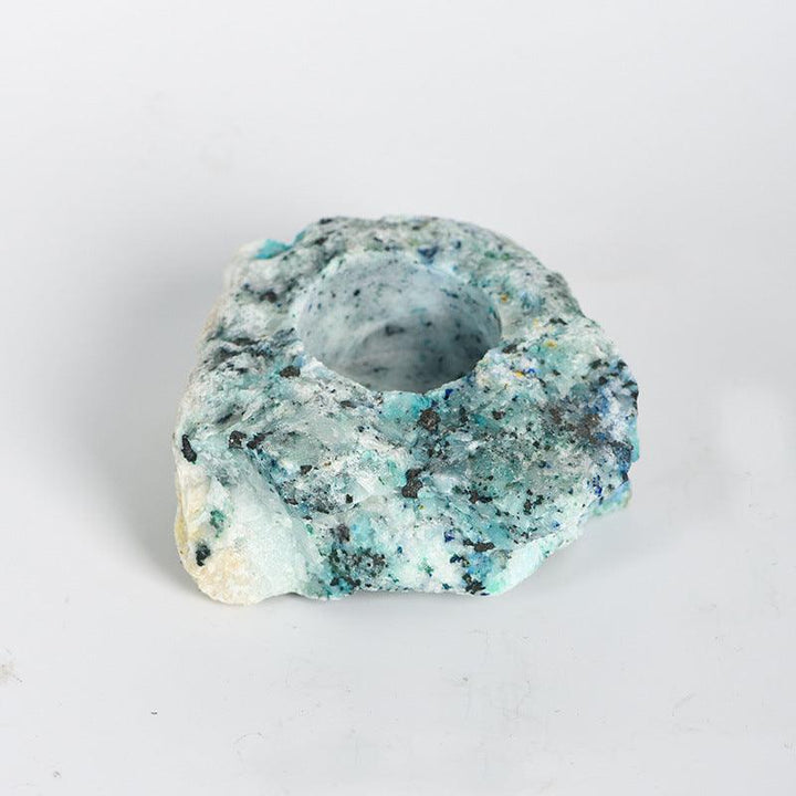 natural phoenix stone crystal raw stone candle holder on the table