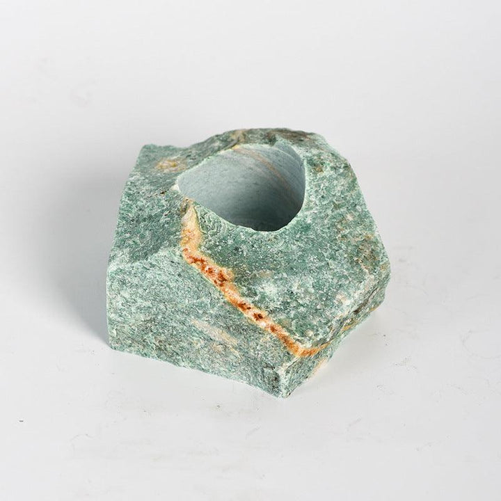 natural Celestial Rock crystal raw stone candle holder on the table