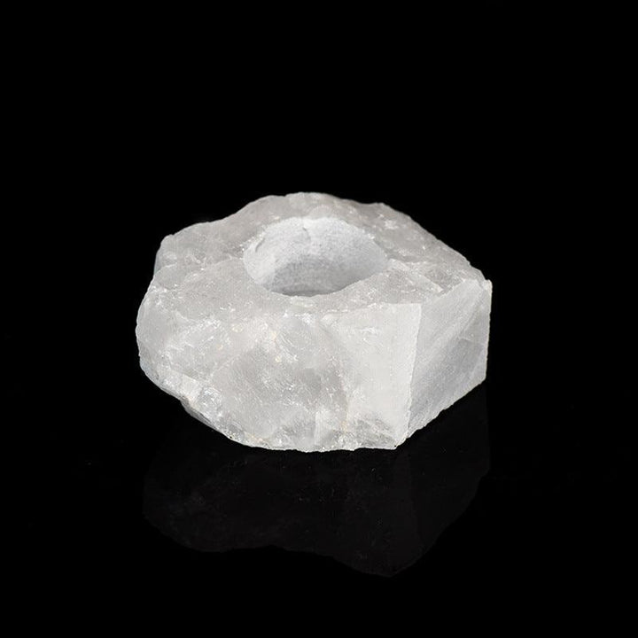 natural white crystal raw stone candle holder on the table