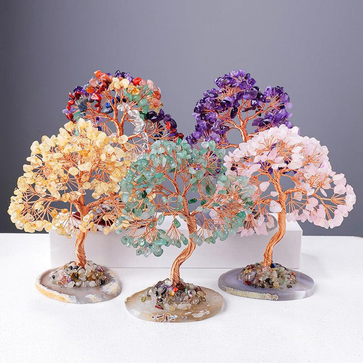 natural rainbow crystal wealth tree with agate base on the table