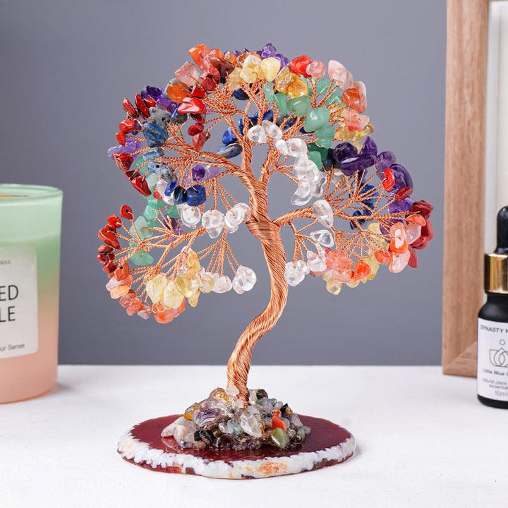 natural rainbow crystal wealth tree with agate base on the table